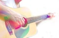 Colored image of male hand playing on acoustic guitar Royalty Free Stock Photo