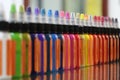 Colored inks in plastic containers formed in a row and bokeh background Royalty Free Stock Photo