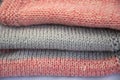 Colored jersey items are stacked. Pink jersey with gray stripes. Knitted fabric