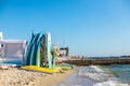 Colored kayaks and surfboards on the beach near the sea. Travel and vacation concept boards at sea Royalty Free Stock Photo