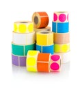 Colored label rolls isolated on white background with shadow reflection. Color reels of labels for printers.