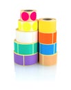 Colored label rolls isolated on white background with shadow reflection. Color reels of labels for printers.