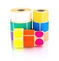 Colored label rolls isolated on white background with shadow reflection. Color reels of labels for printers.