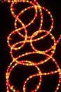 Colored light christmas garland illumination background, unfocused. Royalty Free Stock Photo