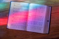 Light from stained glass window falls on open song book in american church Royalty Free Stock Photo