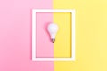 Colored lightbulb on a duotone background