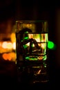 Colored lighting of glasses in the night club bar Royalty Free Stock Photo