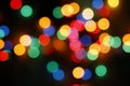 Colored lights, green, red, blue, yellow out of focus