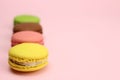 Colored macaroons or macarons on a pink background Royalty Free Stock Photo