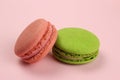Colored macaroons or macarons on a pink background Royalty Free Stock Photo
