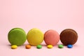 Colored macaroons or macarons on a pink background Royalty Free Stock Photo