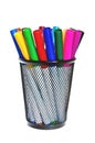 Colored markers in a cup.