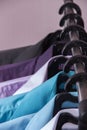 Colored men`s shirts that hang on hangers Royalty Free Stock Photo