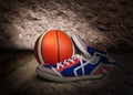 Colored mens sneakers with orange ball Royalty Free Stock Photo