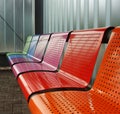 Colored metal bench at a tram bus train stop Royalty Free Stock Photo