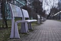 Colored metal bench at a tram bus train stop Royalty Free Stock Photo