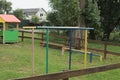 Colored metal sports bars in green grass outdoors