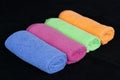 Colored microfiber cleaning cloths,blue, green, orange and pink microfiber cleaning cloths, Royalty Free Stock Photo