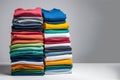 Colored multi-colored T-shirts lie in a stack. Concept of diversity in the world Royalty Free Stock Photo