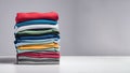 Colored multi-colored T-shirts lie in a stack