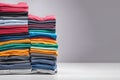 Colored multi-colored T-shirts lie in a stack Royalty Free Stock Photo