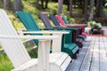 Colored Muskoka chairs on the dock