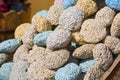 Colored natural pumice stones at the stand on street bazaar in Egypt