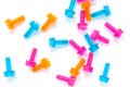 Colored neon translucent plastic toy bolts on white background. Flat lay. Concept World Dad`s Day, unisex toys.