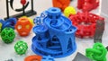 Colored objects created on a 3D printer from liquid molten plastic