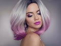 Colored Ombre hair extensions. Beauty Model Girl blonde with short bob purple hairstyle isolated on gray background. Closeup