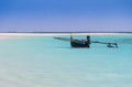 Fishermen pirogue moored on turquoise sea of Nosy Ve island, Indian Ocean, Madagascar