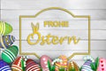 Colored painted eggs 3d rendering model, inscription Happy Easter in German, wooden background for design, postcards, concept of Royalty Free Stock Photo