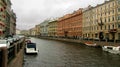 Colored palaces on the river with a boat in St. Petersburg Royalty Free Stock Photo