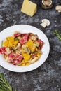 Colored papardelle with chicken, bacon and mushrooms