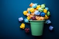 Colored paper balls in blue recycle bin illustrate paper recycling Royalty Free Stock Photo