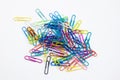 Colored paper clips group on the white desktop background Royalty Free Stock Photo