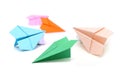Colored paper planes, handmade origami on white