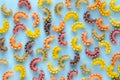 Colored pasta composition on blue background. Flat lay Royalty Free Stock Photo