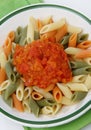 Colored pasta with tomato sauce