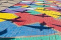 Colored paving slabs and bird shadows. Colorful background Royalty Free Stock Photo