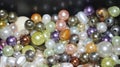 colored pearls close-up. pearl beads round background.blue, purple, green and pink beads texture Royalty Free Stock Photo