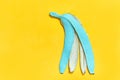 Colored peel banana in cyan color. copy space