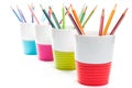 Colored pencil crayons in colorful containers