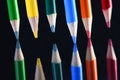 Colored Pencil points on dark glass Royalty Free Stock Photo