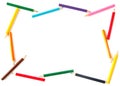 Colored pencils arranged as a frame for inscriptio