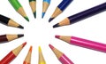 Colored pencils arranged in a circle isolated on a white background. copy paste space Royalty Free Stock Photo