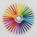 Colored pencils arranged in a circular pattern on a white background Royalty Free Stock Photo
