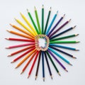 Colored pencils arranged in a circular pattern on a white background Royalty Free Stock Photo
