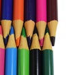 Colored pencils arranged head to head isolated on a white background. copy paste space Royalty Free Stock Photo