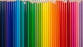 Colored pencils arranged in a row forming a gradient spectrum Royalty Free Stock Photo